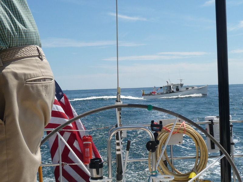close astern.
