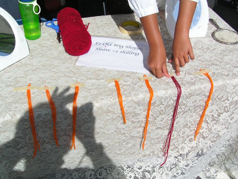 Wig shop advertises.